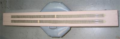 The bridge we duck under to get inside the layout area. It usually has three feet of clearance underneath, but we only need to duck down for a moment, since it's only 6 inches wide.