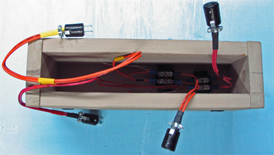 The bottom of the module shows the connecting wires, plugs, and terminal blocks that all the modules have. Those thinner, red and white wires feed the power up to the rails on top of the module. The only thing this module doesn't have that most of them do have is a set of legs. Being such a small module, there is no room for them.