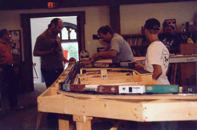 Club members and visitors watching the trains roll.