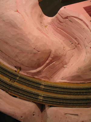 Scenery carved from extruded insulation foam keeps the
      modules light and easy to carry.